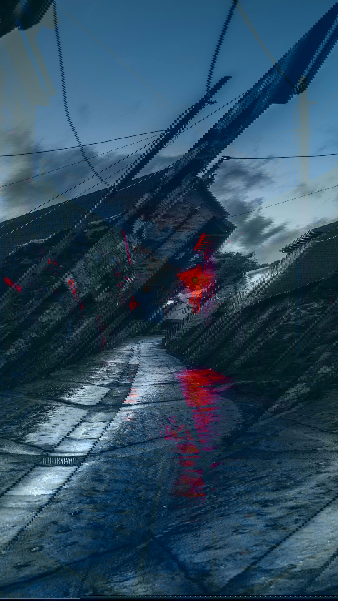 empty street with red and white houses during daytime